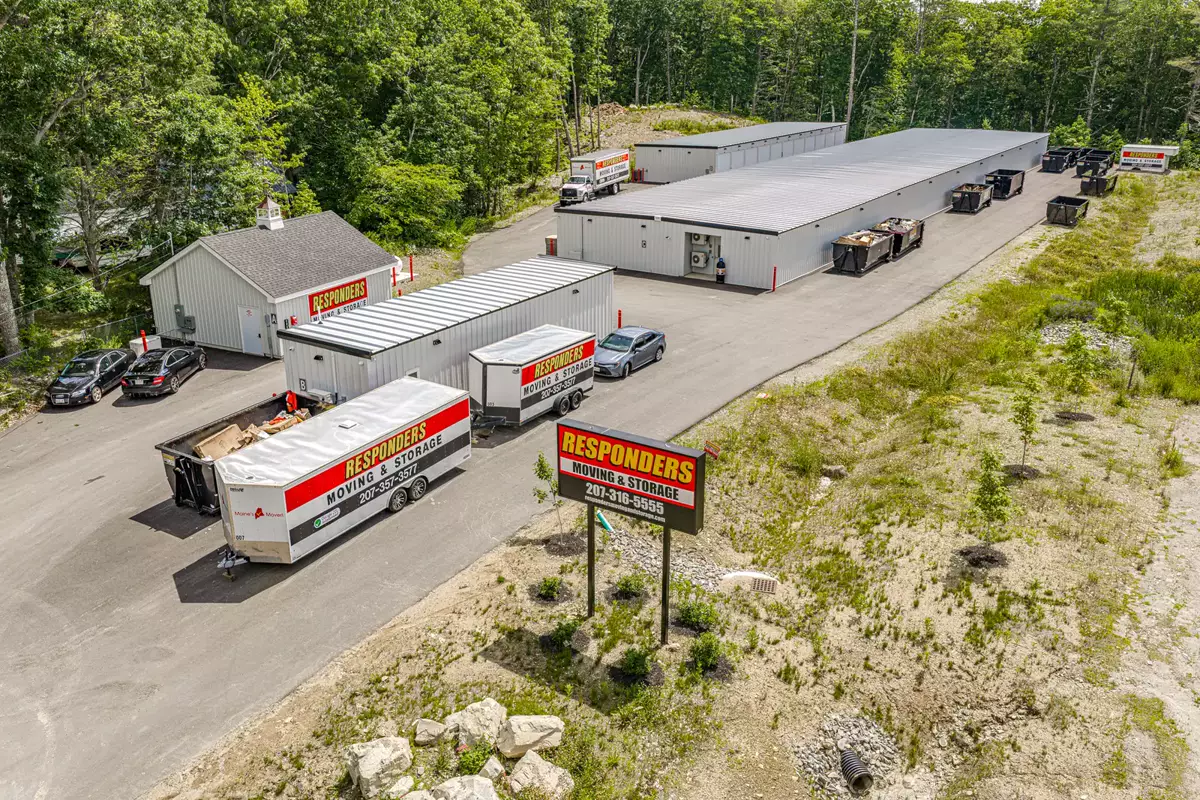 Aerial view of Responders Storage on Outlet Road: storage buildings, the Responders building, the sign and moving trucks