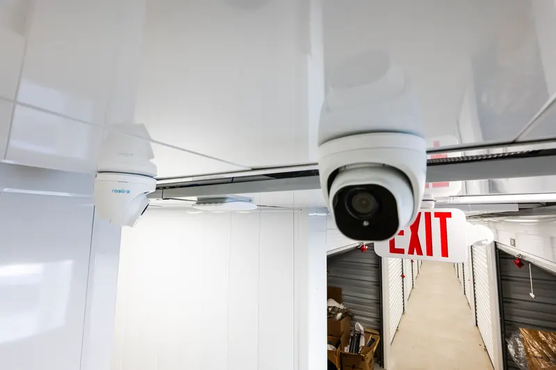 Security cameras on the ceiling of the indoor storage hallway